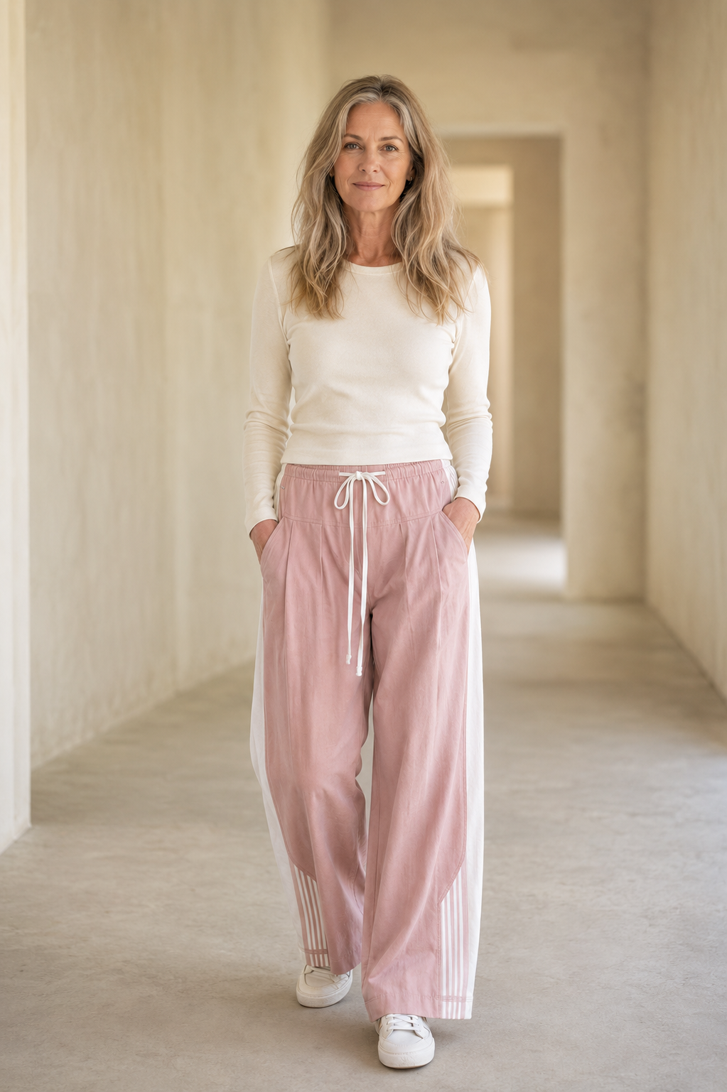 Pink Cotton Blend High Waist Joggers on a mature woman in an empty hallway