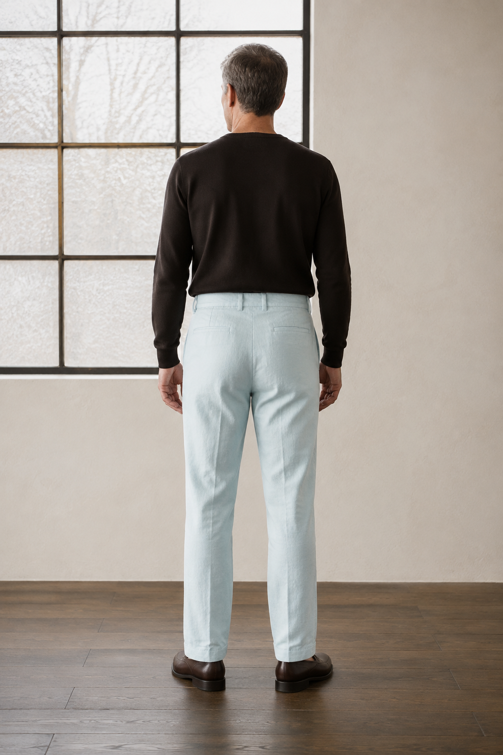 Light blue tapered ankle trousers back view
