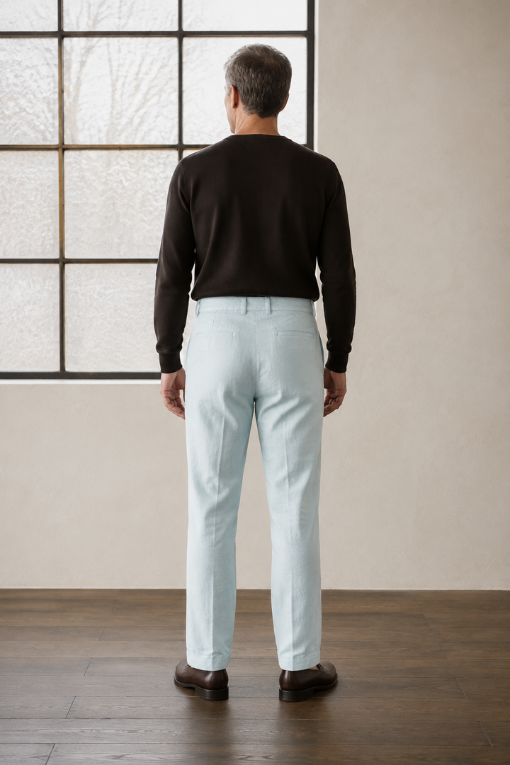Light blue tapered ankle trousers back view