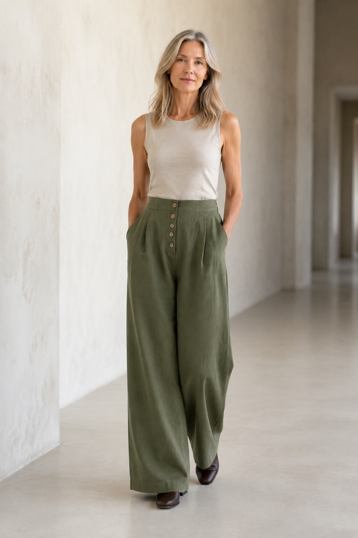 Forest green Cotton Wide Leg Trousers on a mature woman in an empty hallway