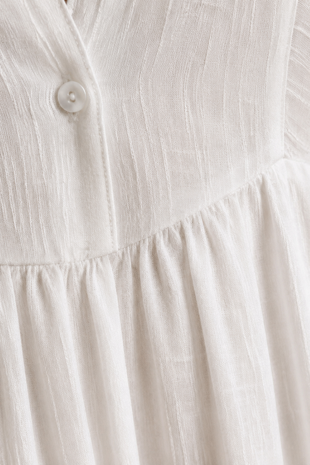 Long Sleeve Button Front Maxi Dress – macro close-up of textured white fabric