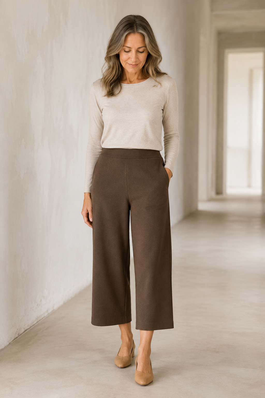 Brown Wool Blend Elastic Waist Trousers on a mature woman in an empty hallway