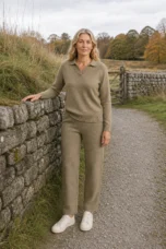 Charline khaki cashmere blend matching set beside an autumn stone wall