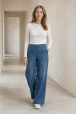 Navy Cotton Denim Wide Leg Jeans on a mature woman in an empty hallway