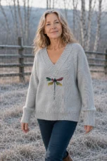 Hermeline Grey dragonfly print V-neck knit, outdoor editorial photograph