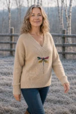 Hermeline Khaki dragonfly print V-neck knit, outdoor editorial photograph