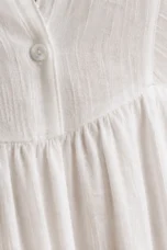 Long Sleeve Button Front Maxi Dress – macro close-up of textured white fabric