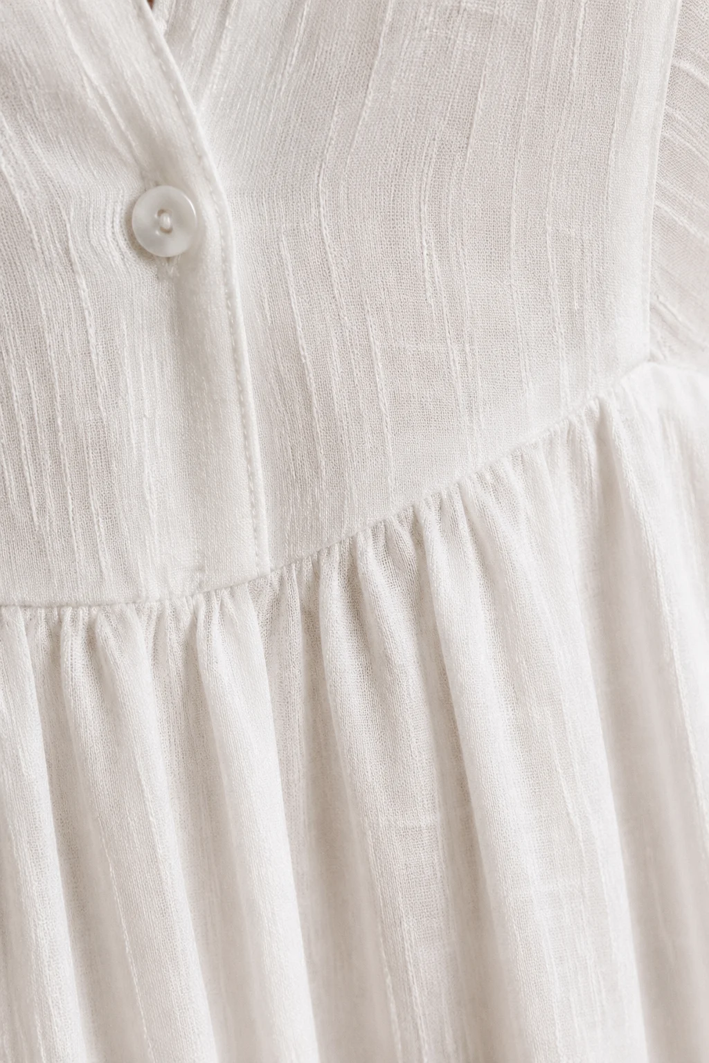 Long Sleeve Button Front Maxi Dress – macro close-up of textured white fabric