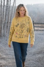 Marguerite 100% Merino Wool Pullover in yellow, outdoor editorial view