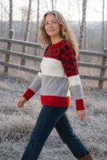 Meredith Muted Leopard Knit Sweater in red, outdoor editorial view