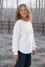 Paula White waffle-knit cotton crew neck sweater, outdoor editorial photograph