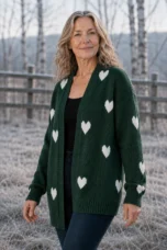 Rosa Knitted-In Heart Cardigan in Green, torso-focused outdoor editorial photograph